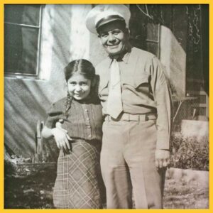 A photo of Miguel Trujillo with his arm around his young daughter, Josephine