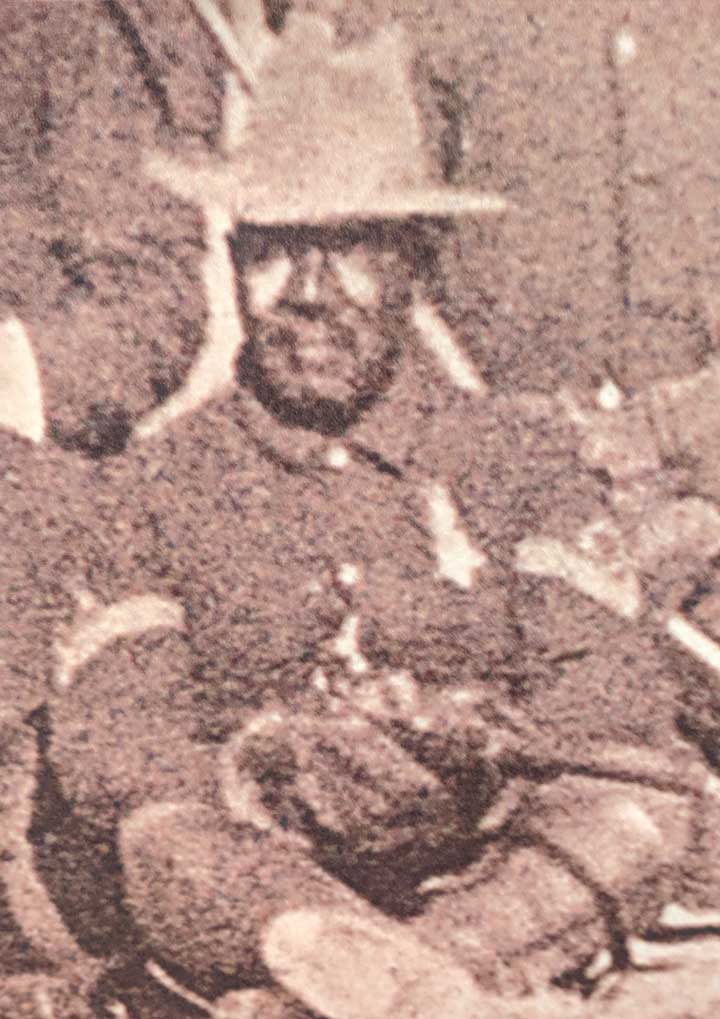 Black and white photo c. 1880 of Sergeant George Jordan in uniform, sitting with other cavalry members