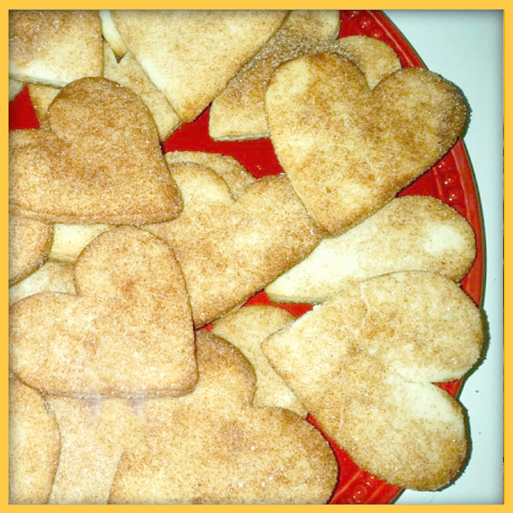 Plate of Biscochitos cookies in the shape of hearts.