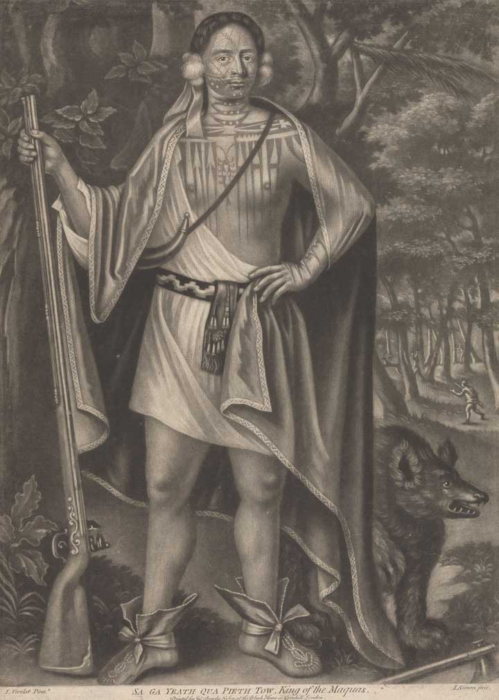 Black and white print of a Native American man posing in the woods with a gun. An axe lays at his feet. A small black bear, or maybe some sort of dog, stands next to him. Men are in the distance carrying guns.
