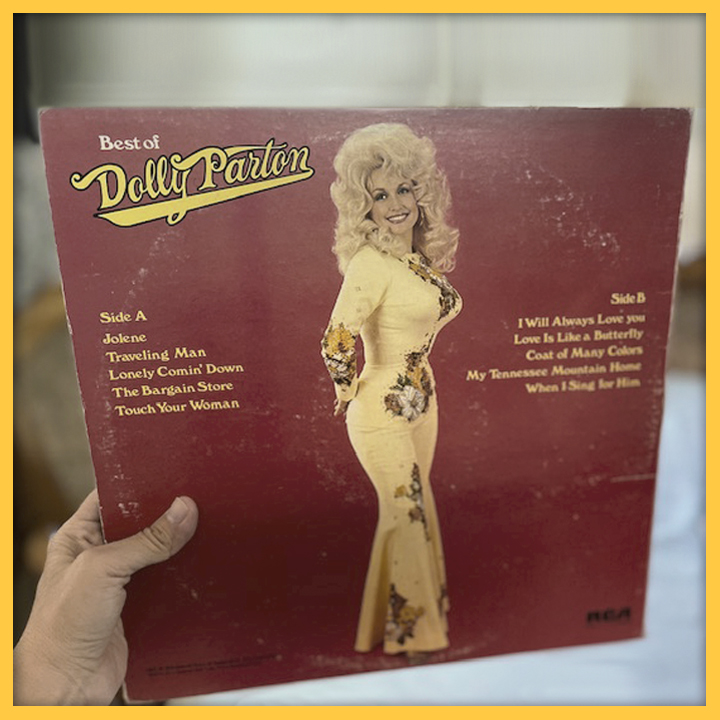 Hand holding a copy of the album "Best of Dolly Parton"