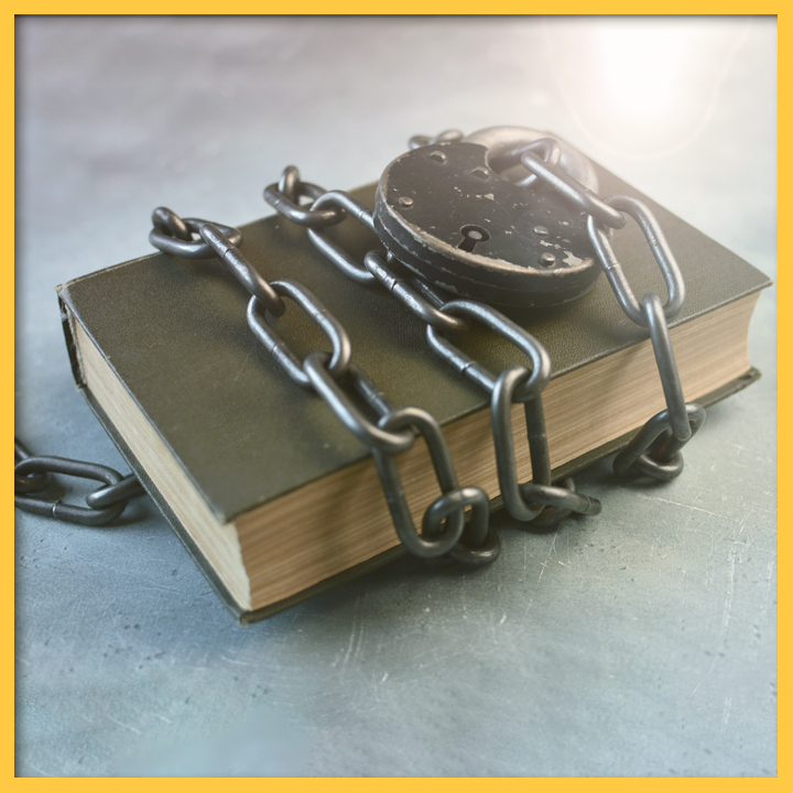 Photo of a book with a chain and lock around it