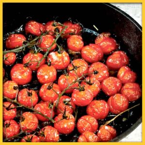 Tomatoes roasting in a castiron skillet