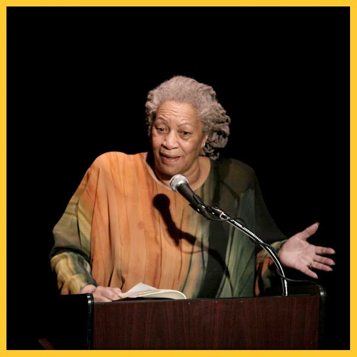 Photo of Toni Morrison at a podium delivering a speech