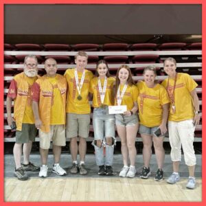 A group of students and teachers posing with awards at the NHD national contest