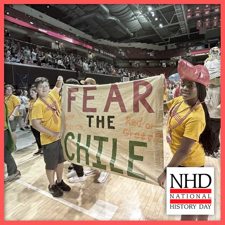 Students holding a banner that reads "FEAR THE CHILE" at the national NHD competition