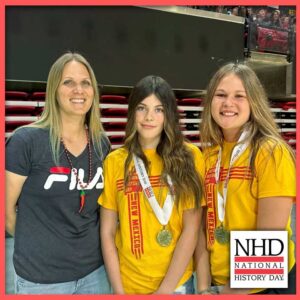 Bria Petersen posing with her daughter and friend, who won medals at the NHD national contest