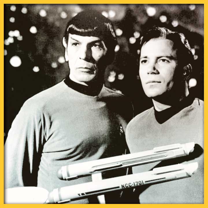 Black and white photo of Leonard Nimoy and William Shatner in costume as Spock and Captain Kirk.