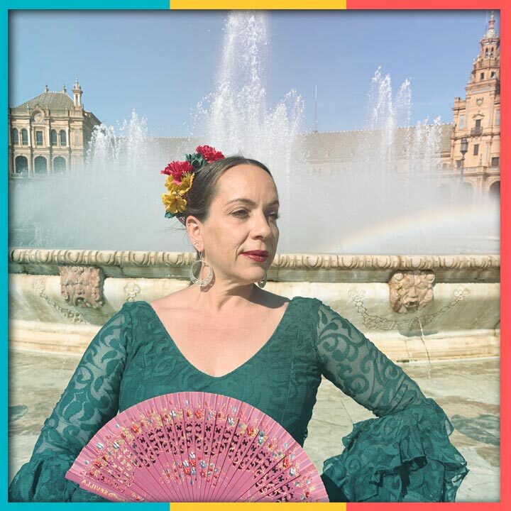 Photo of Nicolasa Chávez in Flamenco dress in front of a fountain