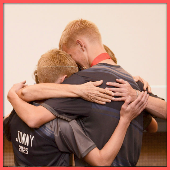 Photo of students in a group hug
